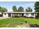 Lovely home with a green lawn, landscaping, and a paved driveway, showcasing a welcoming exterior at 3844 Sw Saddle Ridge Dr, Snellville, GA 30039