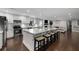 Bright kitchen with white cabinets, stainless appliances, and a large island with seating at 3844 Sw Saddle Ridge Dr, Snellville, GA 30039
