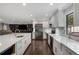 Modern kitchen with stainless steel appliances, subway tile backsplash, and a large center island at 3844 Sw Saddle Ridge Dr, Snellville, GA 30039