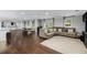 Open-concept living space featuring hardwood floors, and comfortable seating at 3844 Sw Saddle Ridge Dr, Snellville, GA 30039