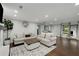 Bright living room with hardwood floors, stylish sofas, and eye-catching decor at 3844 Sw Saddle Ridge Dr, Snellville, GA 30039