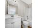 Bathroom featuring a white vanity with chrome fixtures, a large mirror, and a shower-tub combo at 5159 Round Table Dr, Ellenwood, GA 30294