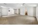 Spacious bonus room featuring neutral walls, carpet floors, multiple windows, and multiple doors at 5159 Round Table Dr, Ellenwood, GA 30294