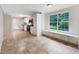 Bright kitchen with stainless appliances, white cabinets, eat in area and a view of the backyard at 5159 Round Table Dr, Ellenwood, GA 30294