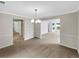 Bright living area featuring neutral paint, new carpet, and updated lighting fixtures for a modern look at 5159 Round Table Dr, Ellenwood, GA 30294