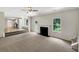Spacious layout featuring a fireplace and seamless flow into the kitchen area for a versatile living space at 5159 Round Table Dr, Ellenwood, GA 30294