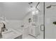 Bright bathroom with a soaking tub, glass-enclosed shower, and dual sinks for a spa-like experience at 658 Mcgruder Ne St, Atlanta, GA 30312