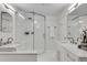 Sleek bathroom with a frameless glass shower, double sinks, and modern fixtures for a luxurious feel at 658 Mcgruder Ne St, Atlanta, GA 30312