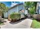 Charming exterior view with light blue siding, a green lawn, and a private driveway at 658 Mcgruder Ne St, Atlanta, GA 30312