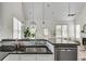 Open kitchen featuring granite countertops, stainless steel appliances, and bright, airy lighting at 658 Mcgruder Ne St, Atlanta, GA 30312
