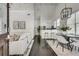 Open-concept living space with modern decor, hardwood floors, and an airy, bright ambiance at 658 Mcgruder Ne St, Atlanta, GA 30312