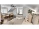 Spacious main bedroom with a ceiling fan and ample room for a seating area beneath a sunny window at 658 Mcgruder Ne St, Atlanta, GA 30312