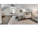 Sunlit main bedroom with a window seat and a ceiling fan providing an inviting space for relaxation at 658 Mcgruder Ne St, Atlanta, GA 30312
