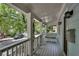 Inviting front porch with a swing offers a relaxing space to enjoy the neighborhood views at 658 Mcgruder Ne St, Atlanta, GA 30312