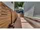 Side yard with stepping stones and a wooden fence, providing a private walkway at 658 Mcgruder Ne St, Atlanta, GA 30312