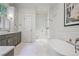 Elegant bathroom featuring a modern soaking tub and tiled glass enclosed shower at 15 Northwood Ne Ave, Atlanta, GA 30309