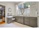 Bright bathroom vanity with double mirror, granite countertops, and cabinetry at 15 Northwood Ne Ave, Atlanta, GA 30309