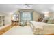 Bright bedroom boasts a sitting area, white rug, and soothing natural light filtering through the window at 15 Northwood Ne Ave, Atlanta, GA 30309