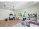 Bright, airy exercise room with modern equipment, neutral colors, and large windows for natural light at 15 Northwood Ne Ave, Atlanta, GA 30309