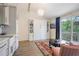 Stylish living room boasts a murphy bed, balcony, and charming decor, offering comfort and functionality at 15 Northwood Ne Ave, Atlanta, GA 30309