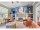 Comfortable seating near fireplace, bright window, and built-in bookshelves makes this living room a gem at 15 Northwood Ne Ave, Atlanta, GA 30309