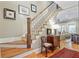 Elegant staircase with natural wood steps and white risers that leads to the upper level of the home at 15 Northwood Ne Ave, Atlanta, GA 30309