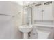 Bright bathroom featuring a pedestal sink, storage cabinet, and modern fixtures at 1501 Clairmont Rd # 1522, Decatur, GA 30033
