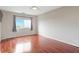 Bedroom features hardwood floors, a window, and a ceiling fan at 1501 Clairmont Rd # 1522, Decatur, GA 30033