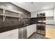 Modern kitchen features stainless steel appliances, stone countertops, and open shelving at 1501 Clairmont Rd # 1522, Decatur, GA 30033