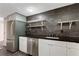 Well-lit kitchen with stainless appliances, dark countertops, and open shelving at 1501 Clairmont Rd # 1522, Decatur, GA 30033