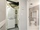 Laundry room featuring a stackable washer/dryer, storage shelves, and access to a bathroom at 1501 Clairmont Rd # 1522, Decatur, GA 30033
