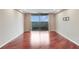Bright living room with hardwood floors and a sliding glass door to a balcony at 1501 Clairmont Rd # 1522, Decatur, GA 30033