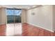Spacious living room with hardwood floors and access to a private balcony with city views at 1501 Clairmont Rd # 1522, Decatur, GA 30033