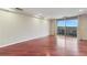 Living room with hardwood floors, neutral walls, and sliding door to balcony at 1501 Clairmont Rd # 1522, Decatur, GA 30033