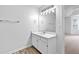 Well lit bathroom features a vanity, mirror, and vinyl flooring at 165 Lost Lake Trl, Villa Rica, GA 30180