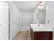 Bathroom with a combined tub and shower, modern fixtures, vanity and tile flooring at 165 Lost Lake Trl, Villa Rica, GA 30180
