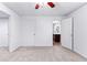 Finished basement bedroom featuring new paint and carpet, a ceiling fan, and access to an adjacent bathroom at 165 Lost Lake Trl, Villa Rica, GA 30180
