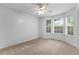 A bright bedroom with carpet, natural light and a ceiling fan at 165 Lost Lake Trl, Villa Rica, GA 30180