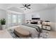 Beautiful bedroom features tray ceiling, bay windows and stylish decor at 165 Lost Lake Trl, Villa Rica, GA 30180