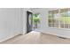 Bright foyer with carpeted flooring, a decorative front door, and a window at 165 Lost Lake Trl, Villa Rica, GA 30180