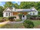 Charming ranch-style home featuring a stone facade, well-maintained landscaping, and a welcoming front porch at 165 Lost Lake Trl, Villa Rica, GA 30180