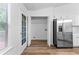Bright eat in kitchen features stainless steel appliances and an exterior door at 165 Lost Lake Trl, Villa Rica, GA 30180