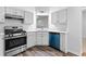 The open kitchen features modern appliances, lots of storage, and bright lighting at 165 Lost Lake Trl, Villa Rica, GA 30180