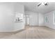 Inviting living room with neutral walls and a view into the kitchen at 165 Lost Lake Trl, Villa Rica, GA 30180