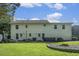 Large backyard with a fire pit, seating area, and well-maintained lawn at 4271 Keheley Ne Rd, Marietta, GA 30066