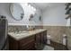 Modern bathroom featuring double vanity with granite countertop and decorative mirrors at 4271 Keheley Ne Rd, Marietta, GA 30066