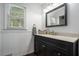 The bathroom offers a vanity, mirror, faucet, and a decorative towel at 4271 Keheley Ne Rd, Marietta, GA 30066