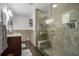 Bathroom featuring a glass enclosed tile shower, vanity with sink and modern fixtures at 4271 Keheley Ne Rd, Marietta, GA 30066
