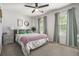 Comfortable bedroom with large windows, ceiling fan and decoratively draped windows at 4271 Keheley Ne Rd, Marietta, GA 30066