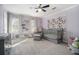 Bedroom with lavender colored walls, crib, chair, ottoman, dresser and lots of sunlight at 4271 Keheley Ne Rd, Marietta, GA 30066